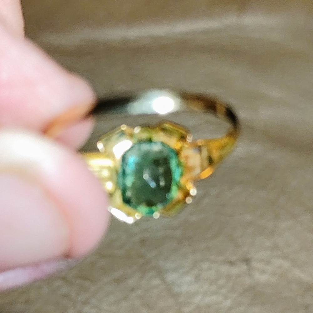Peridot stone set in 10k.